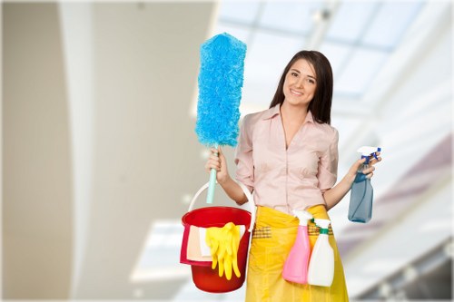 Professional cleaner maintaining shared hallway and lift area
