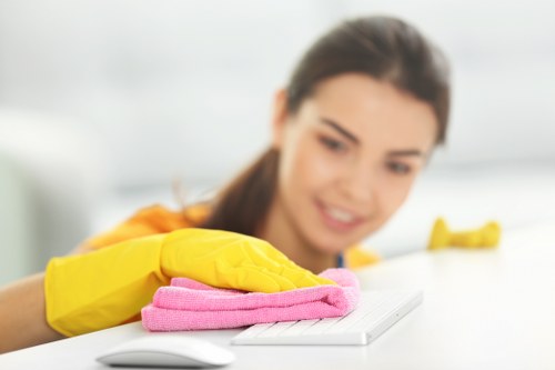 Cleaning staff disinfecting high-touch surfaces in a business space