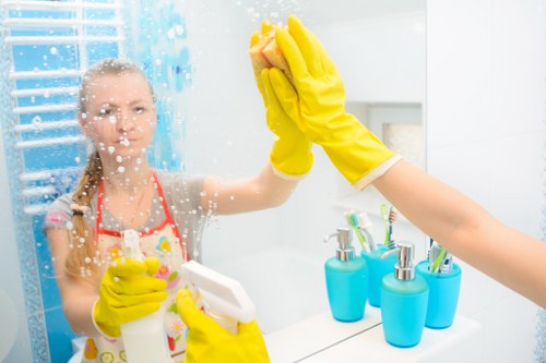 Professional commercial cleaners working in a modern workplace
