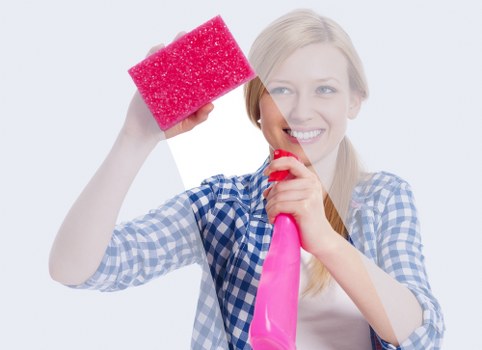 Professional Airbnb cleaning in progress in a modern rental kitchen