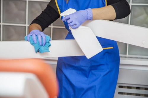 Technician vacuuming upholstered furniture for deep cleaning